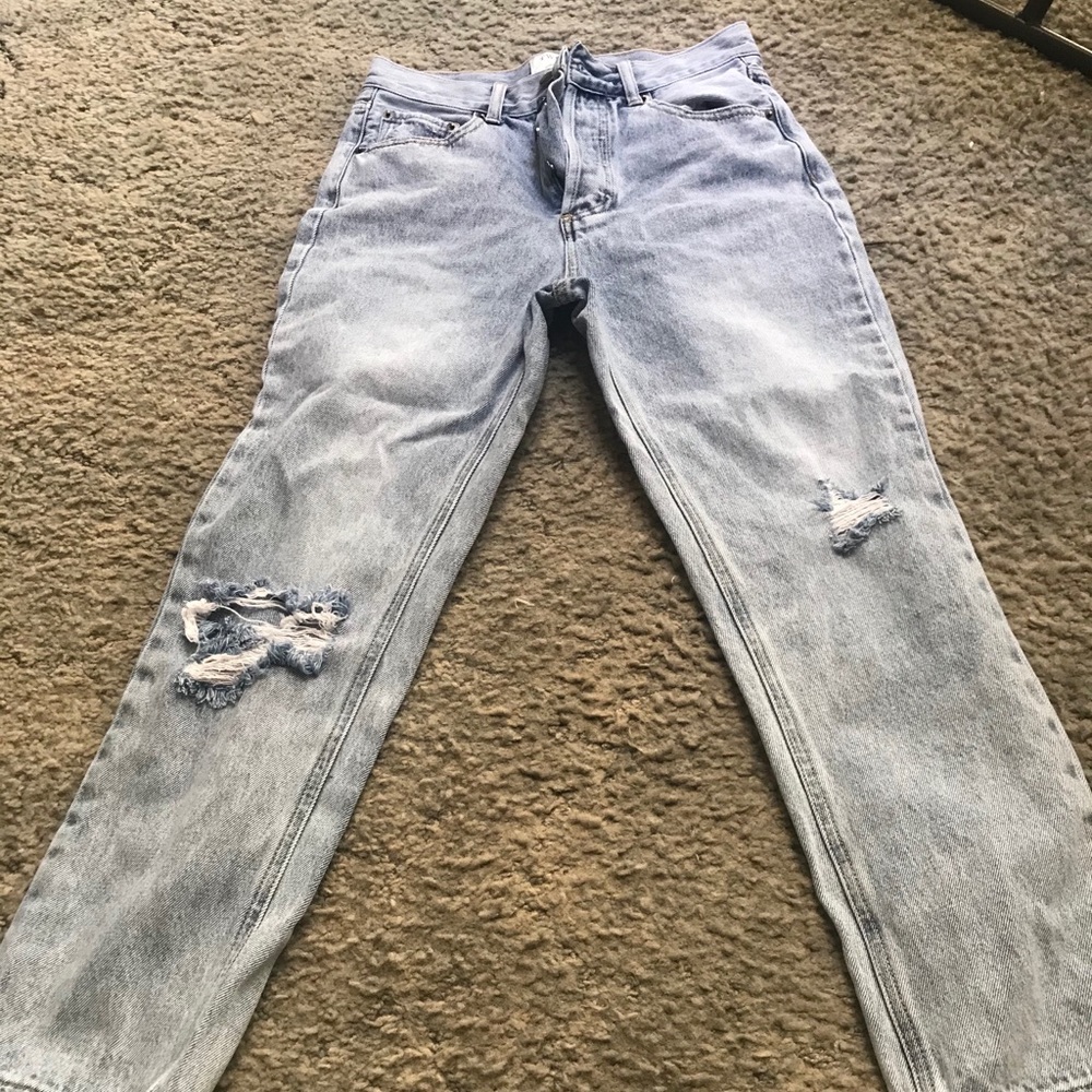 High waisted button fly distressed jeans